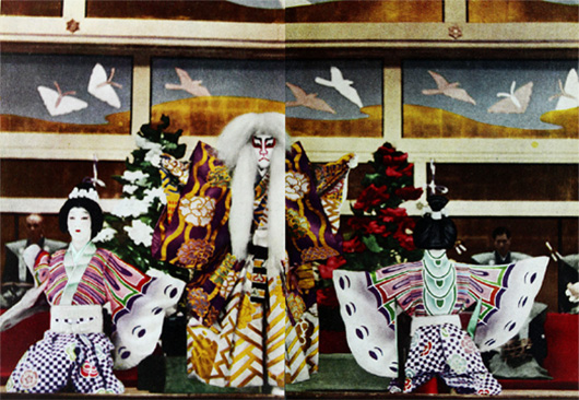 A spirited lion (center) sports with the butterflies